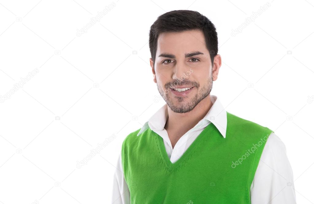 Happy young man in a green shirt isolated on white.