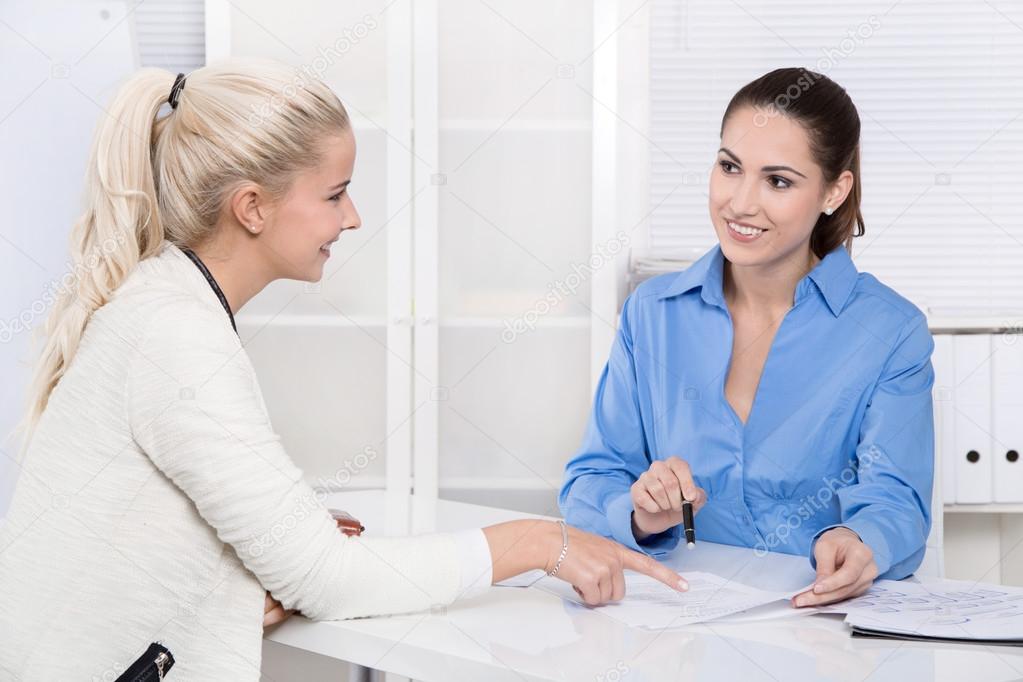 Two business woman at desk - application or interview - talking