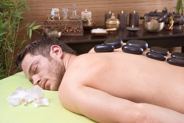 Traditional thai massage - man getting hotstone treatment — Stock Photo, Image