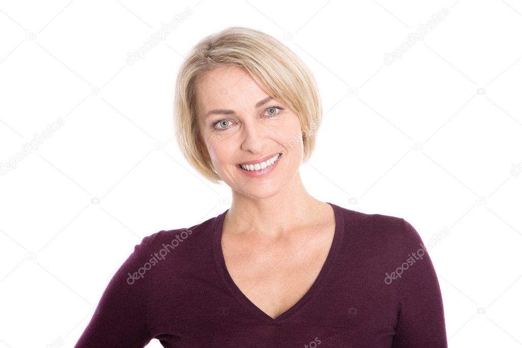 Isolated older woman with blond hair - relaxt and smiling.