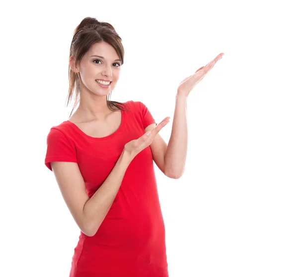 Isolated young woman presenting in a red shirt. Royalty Free Stock Images