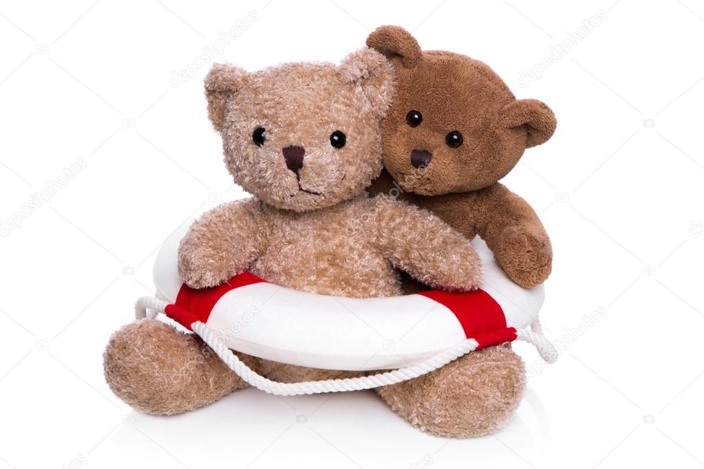 Concept for teamwork - two isolated teddy bears with a lifebelt.