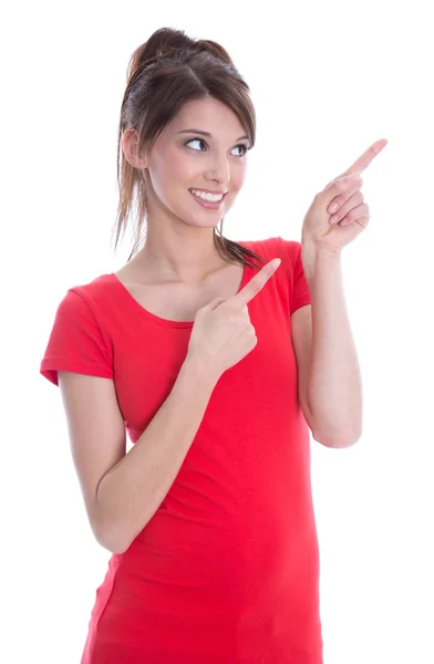 Geïsoleerde jonge vrouw in het rood is presenteren met haar wijsvinger. — Stockfoto