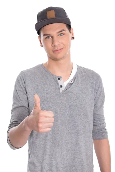 Jonge aantrekkelijke mannelijke tiener met duim geïsoleerd op wit. Stockfoto