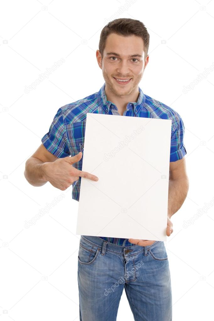 Smiling man holding a white sign in his hands.