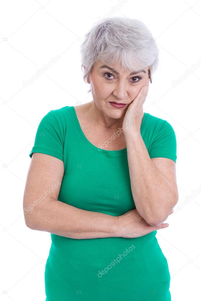 Pensive and sad older woman isolated on white.