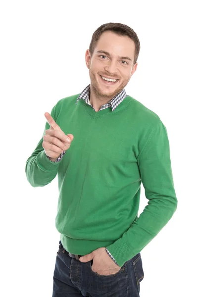 Hombre feliz aislado en verde presentando con dedo índice . — Foto de Stock