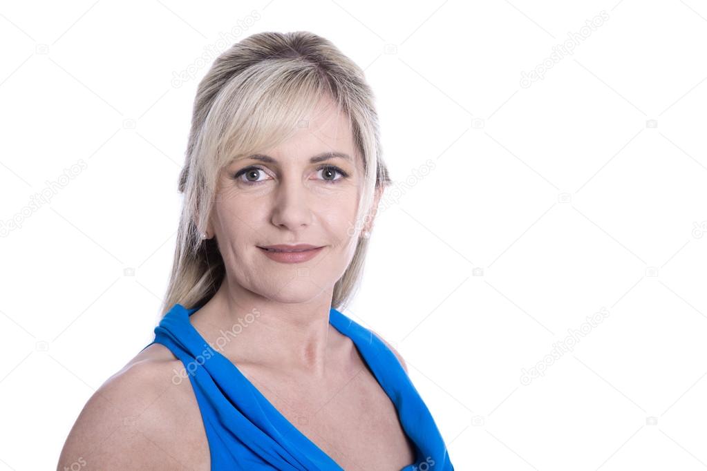 Isolated face of a beautiful middle aged blond woman in blue.