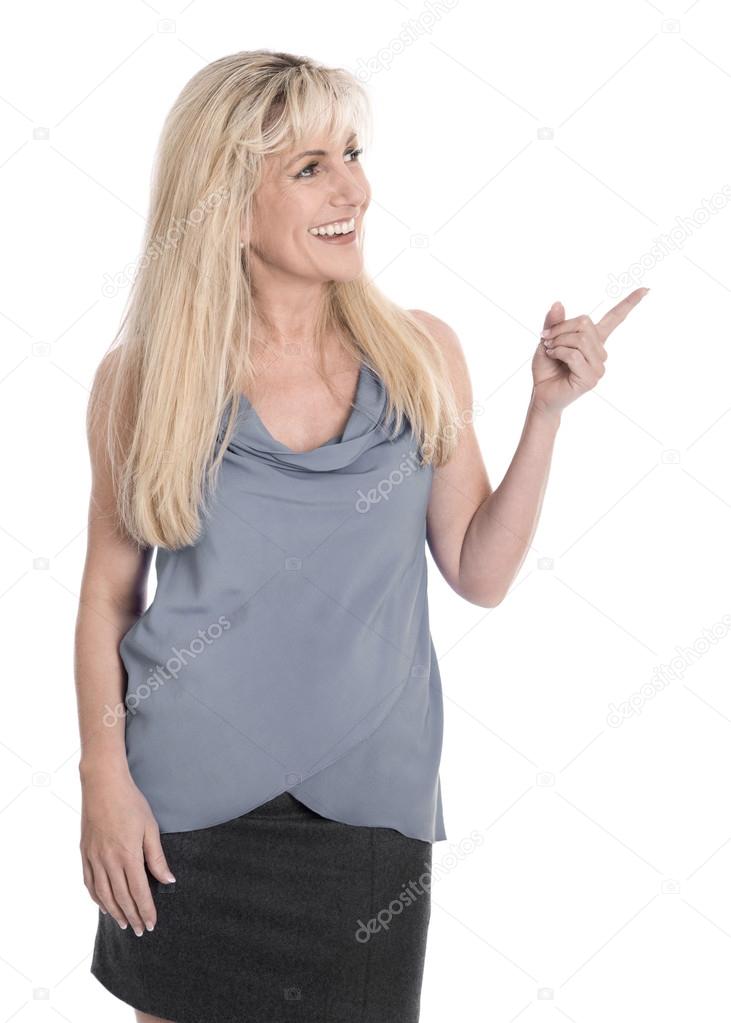 Attractive mature business woman is pointing with forefinger.