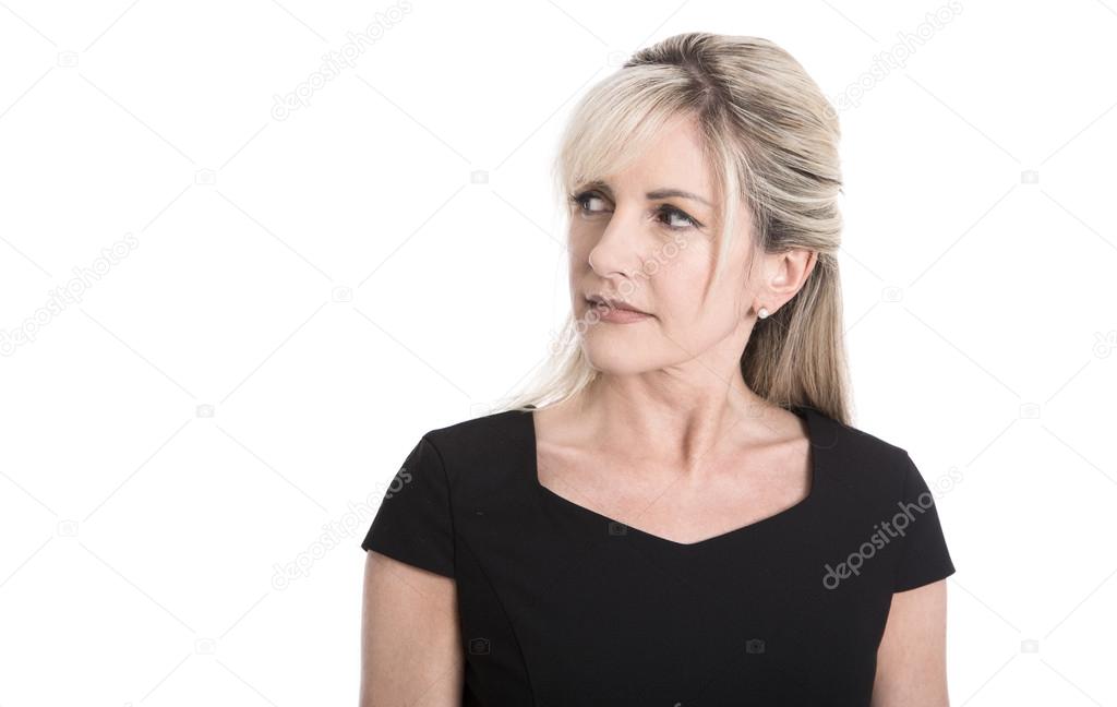 Skeptical face of a elderly attractive blond businesswoman.