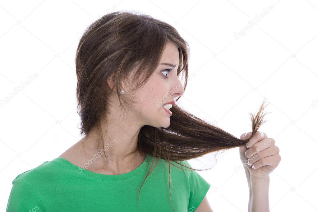 Shocked and sad woman - broken hair after coloration.