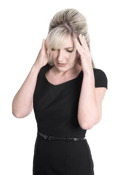 Isolated mature woman in black dress has headache. — Stock Photo, Image