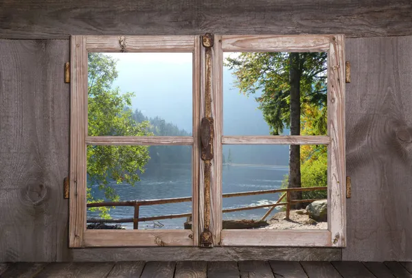 House on the sea in the alps - old rustic wooden window. — Stock Photo, Image