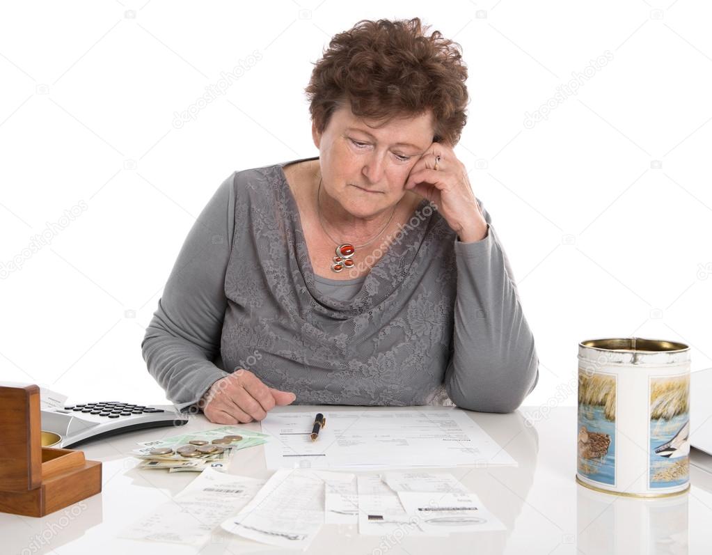 Sad pensioner woman have money problems - poverty in the age.