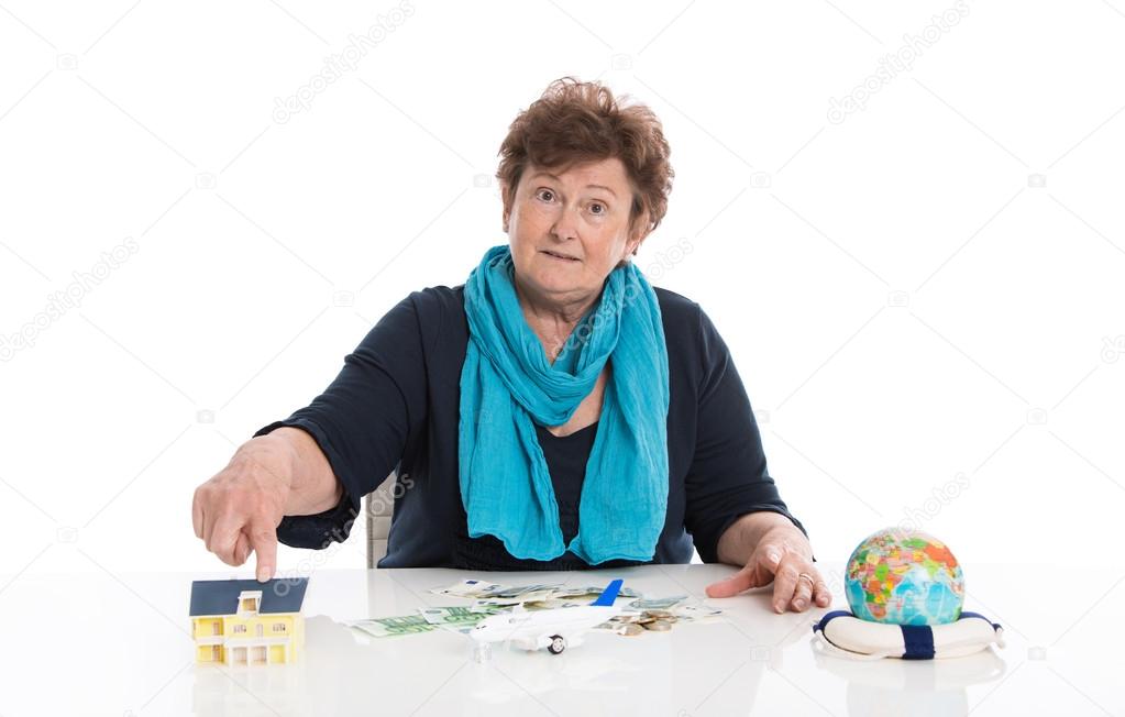 Isolated senior woman think about her money - concept for pensio