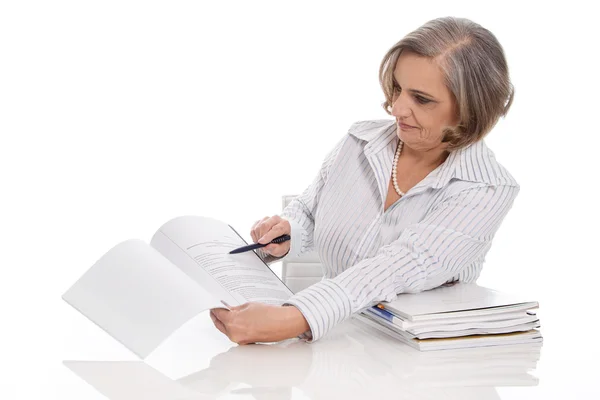 Portrait of professional older businesswoman presenting a paper. — Stock Photo, Image