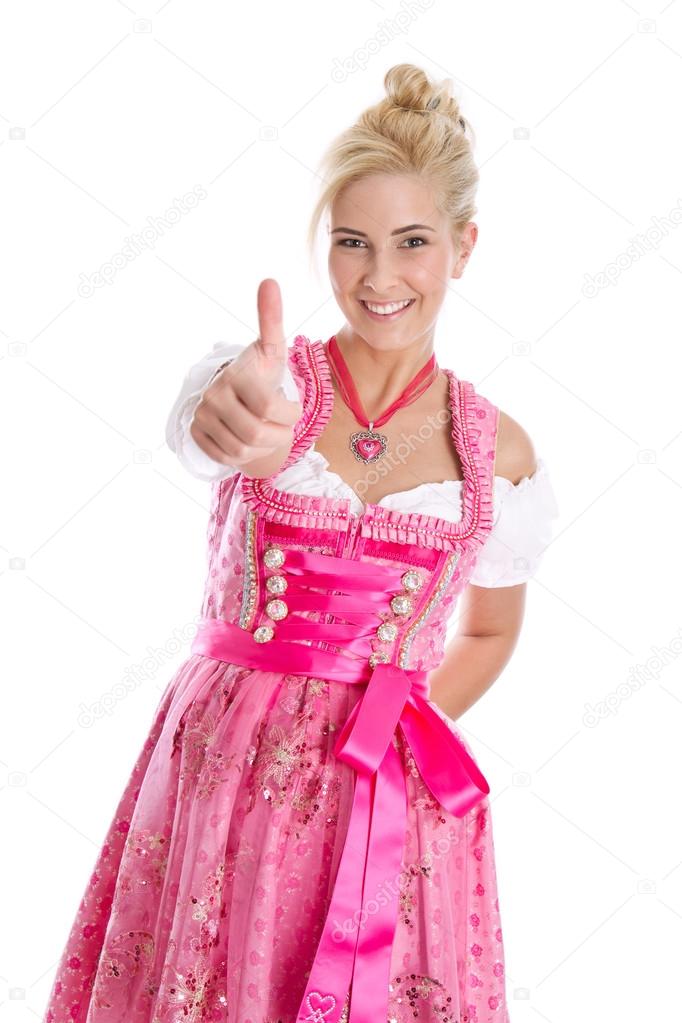 Happy young blond woman in dirndl dress in bavarian folkart.