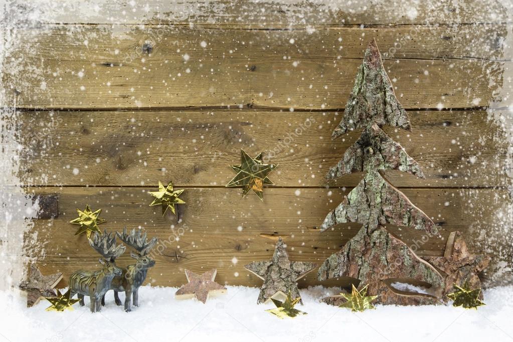 Wooden country style christmas background with reindeer and snow