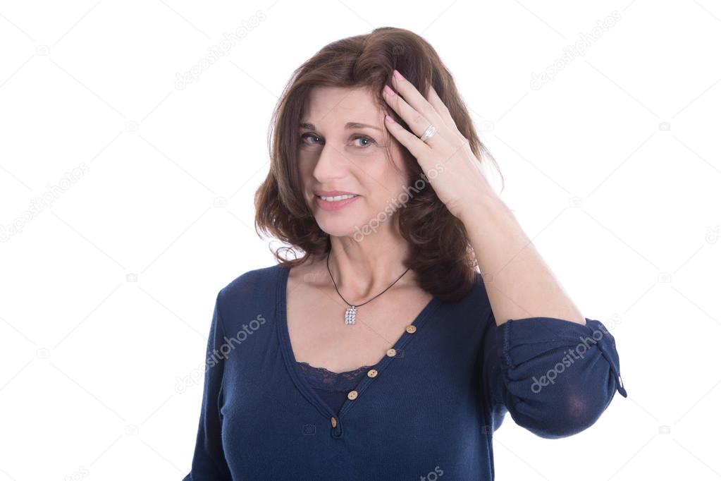 Doubtful and pensive mature woman in blue isolated on white.