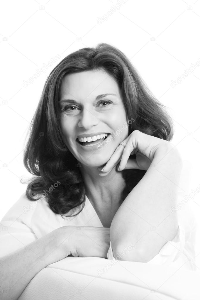 Pretty mature woman face isolated over white background.