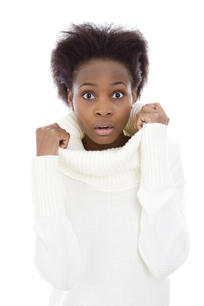 Scared and shocked african american black woman in white sweater