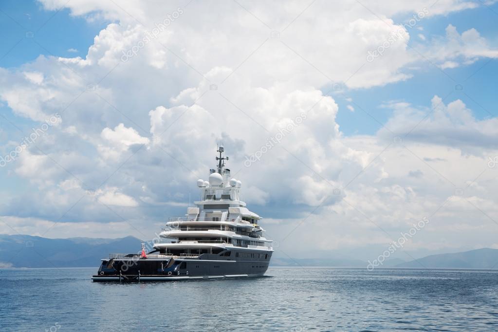 Gigantic big and large luxury mega yacht with helicopter landing
