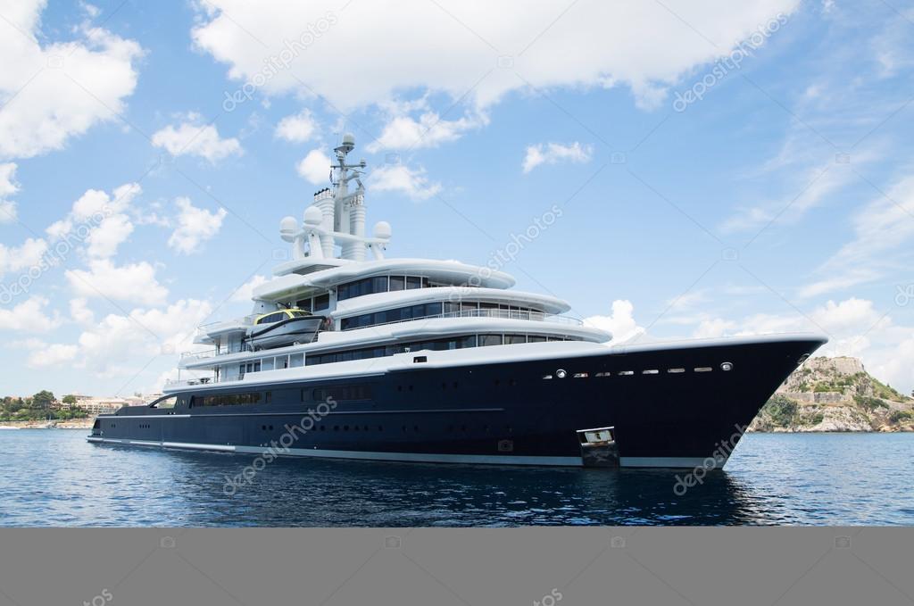 Gigantic big and large luxury mega yacht with helicopter landing