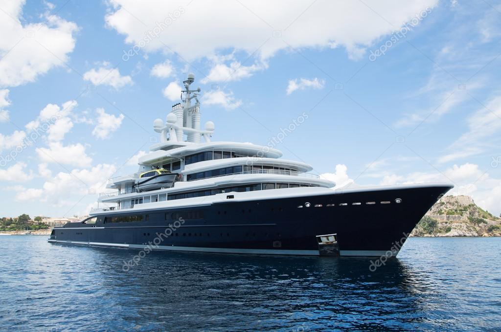 Gigantic big and large luxury mega yacht with helicopter landing