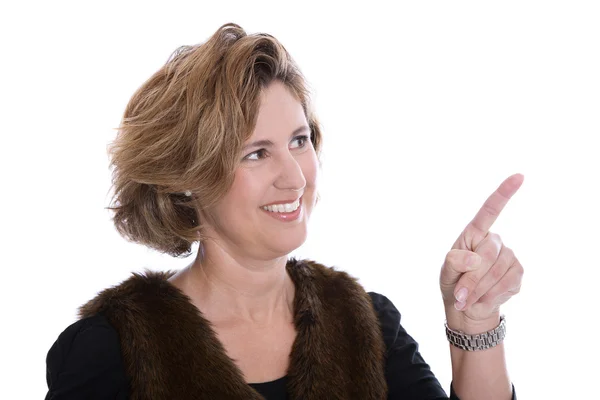 Isolated businesswoman in winter clothes presenting with her for Stock Image