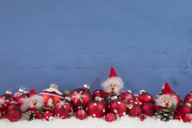 Wooden blue christmas background with red and white decoration. clipart