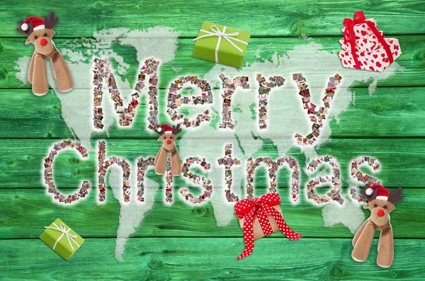 Merry christmas greetings with text on green wooden background - — Stock Photo, Image