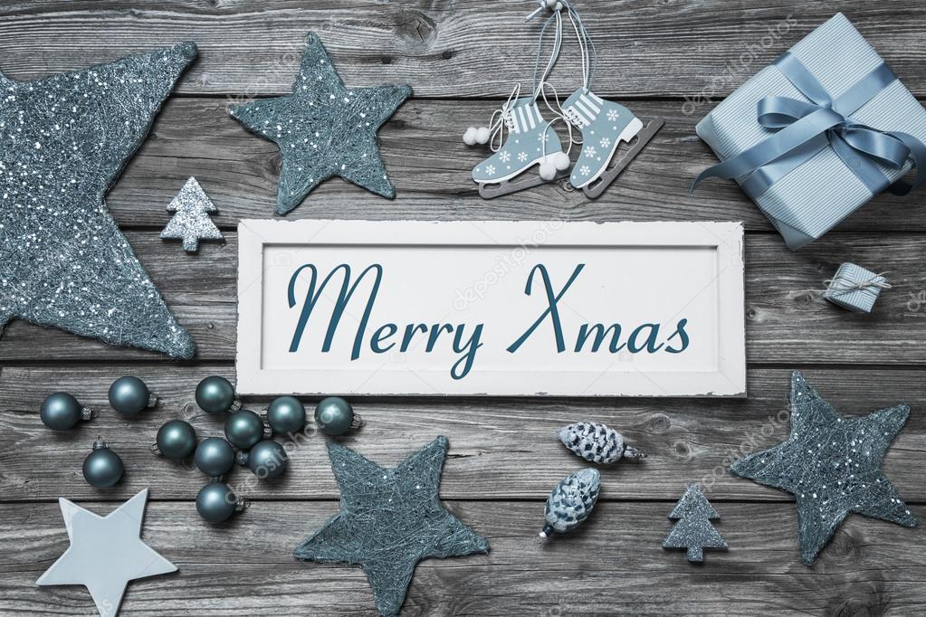 Merry Xmas greeting card with white wooden sign and blue turquoi