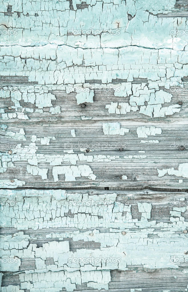 Old wooden background with peeled colour and cracks in mint gree