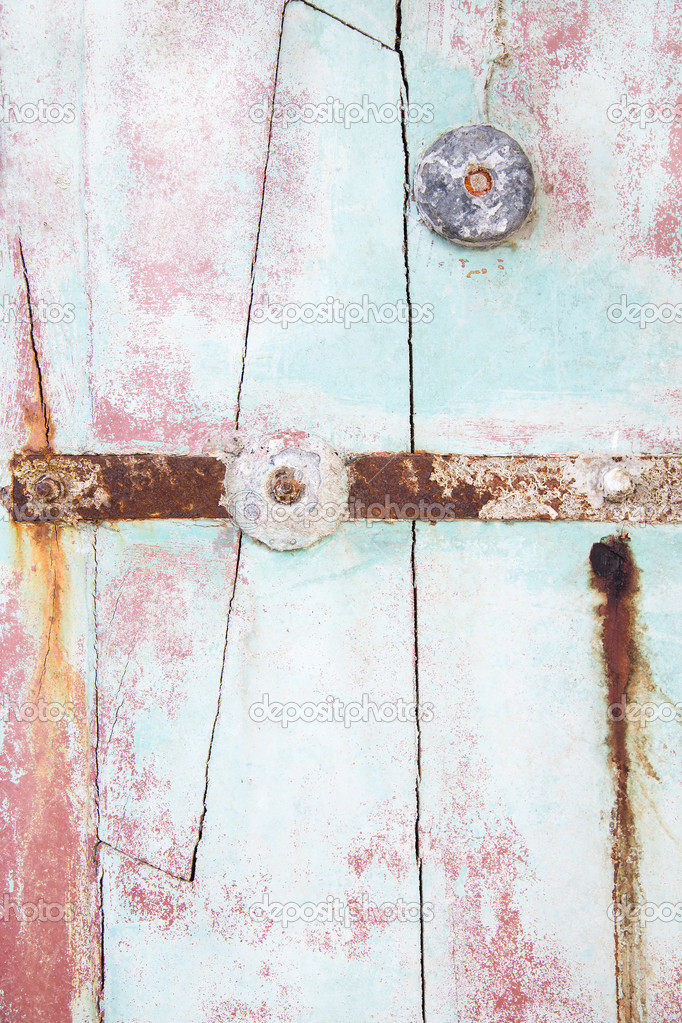 Old wooden background of drift wood in pastel mint green color.