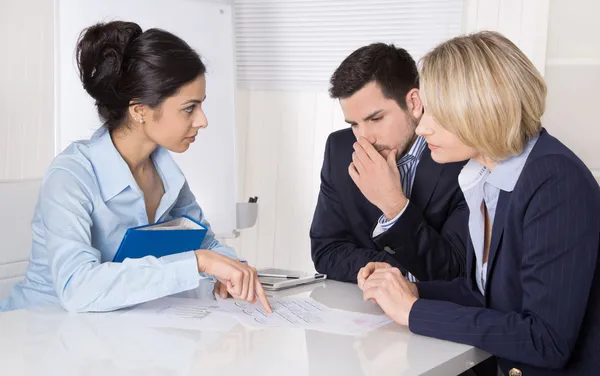 Group of a professional business team sitting at the table talki — Stock Photo, Image