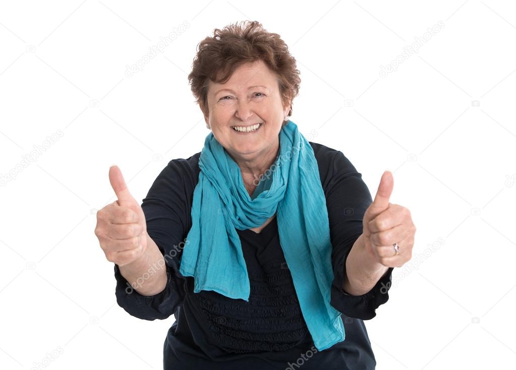 Enthusiastic and happy grandmother making thumbs up gesture with