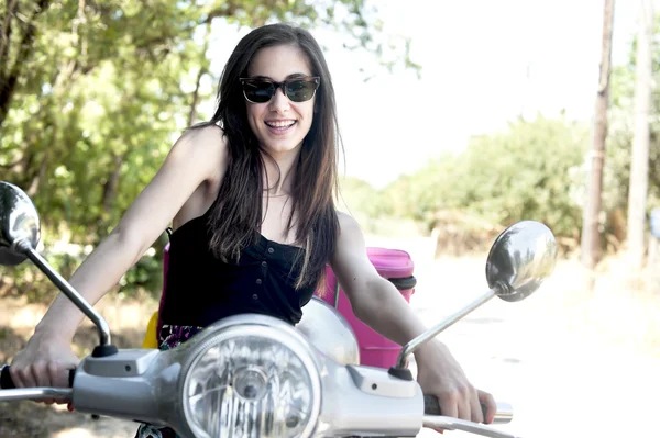 Young female on scooter — Stock Photo, Image