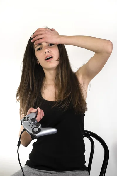 Teenage girl playing video games — Stock Photo, Image