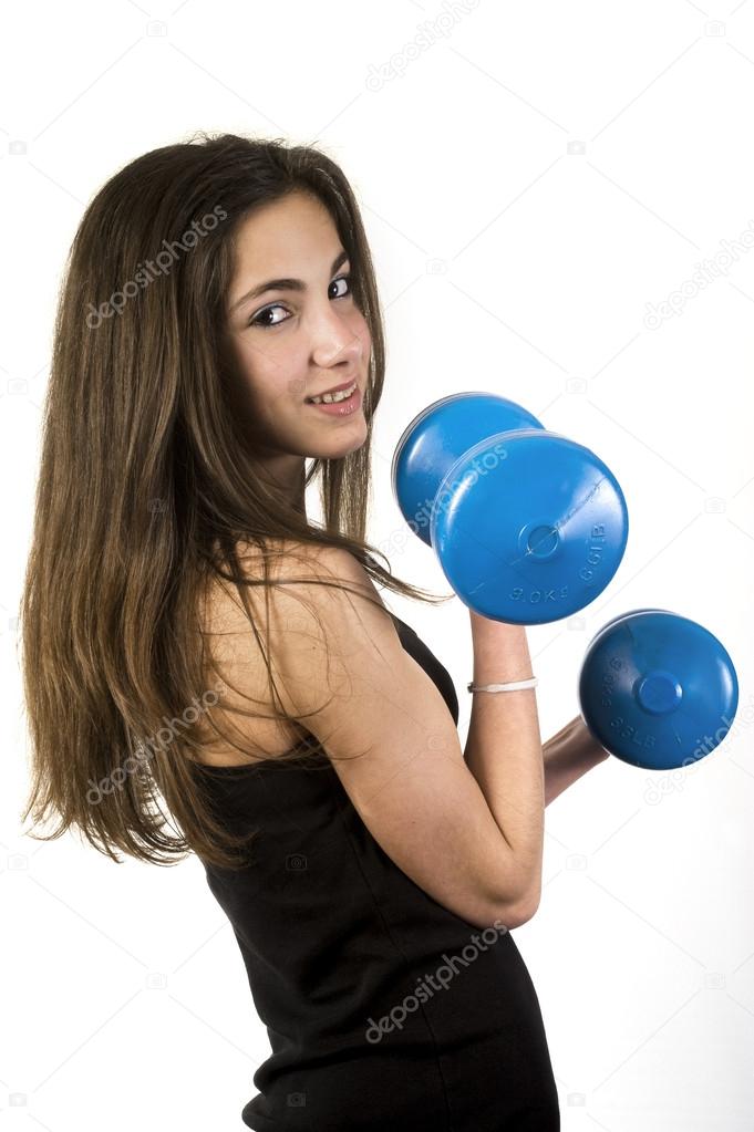 Teenage girl girl lifting weights — Stock Photo © fullframe 35204381
