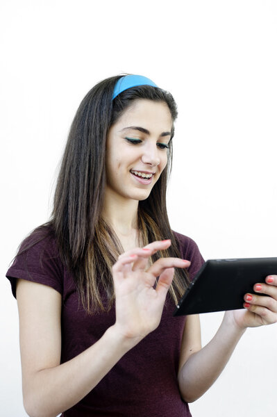 Young female holding a tablet