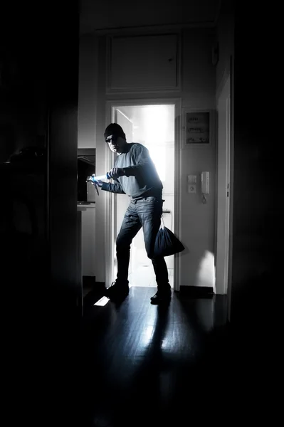 Thief in a house — Stock Photo, Image