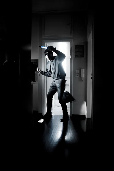 Thief in a house — Stock Photo, Image