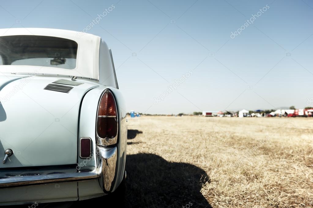 Classic car in a field