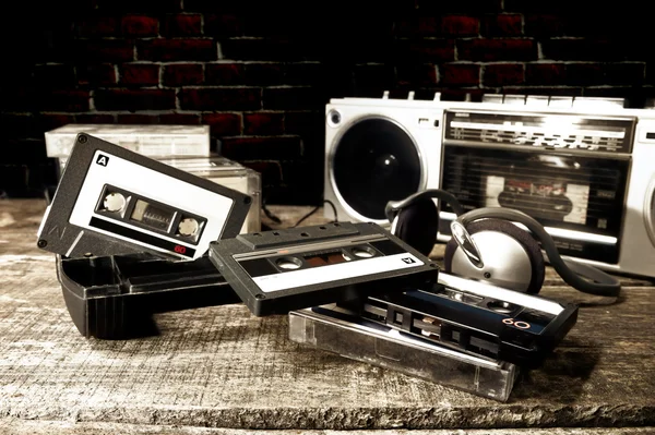 Old cassette tapes and cassette player — Stock Photo, Image