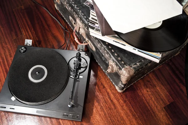 Vintage turntable on floor — Stock Photo, Image