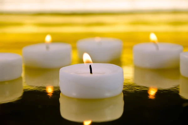 Candles on blurred out background Royalty Free Stock Images