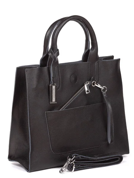 Black large with strap leather woman's handbag isolated on white background.