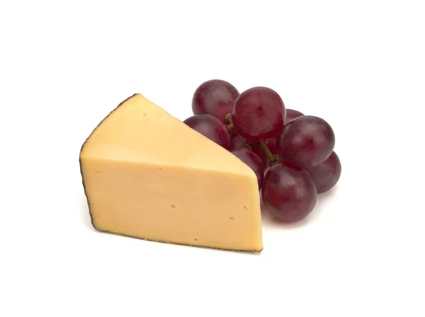 Piece of cheese and grapes isolated on white background — Stock Photo, Image