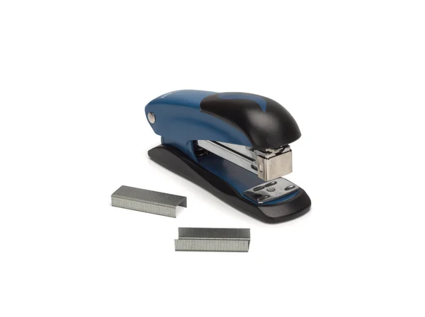 Photo of stapler on white background and staples nearby — Photo