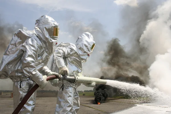 Firefighter in protective suits — Stock Photo, Image